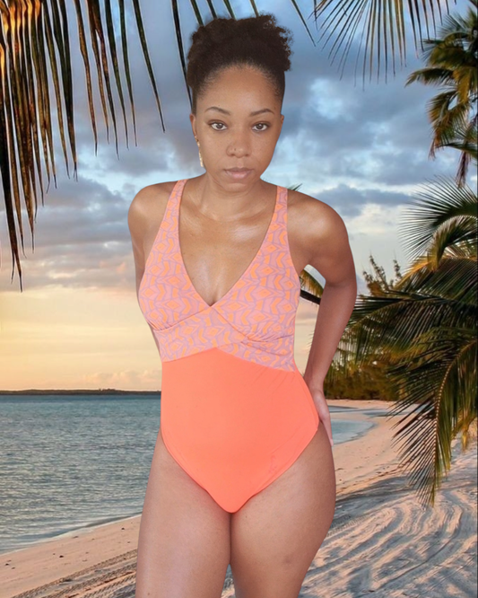 Orange one-piece swimsuit with geometric pattern