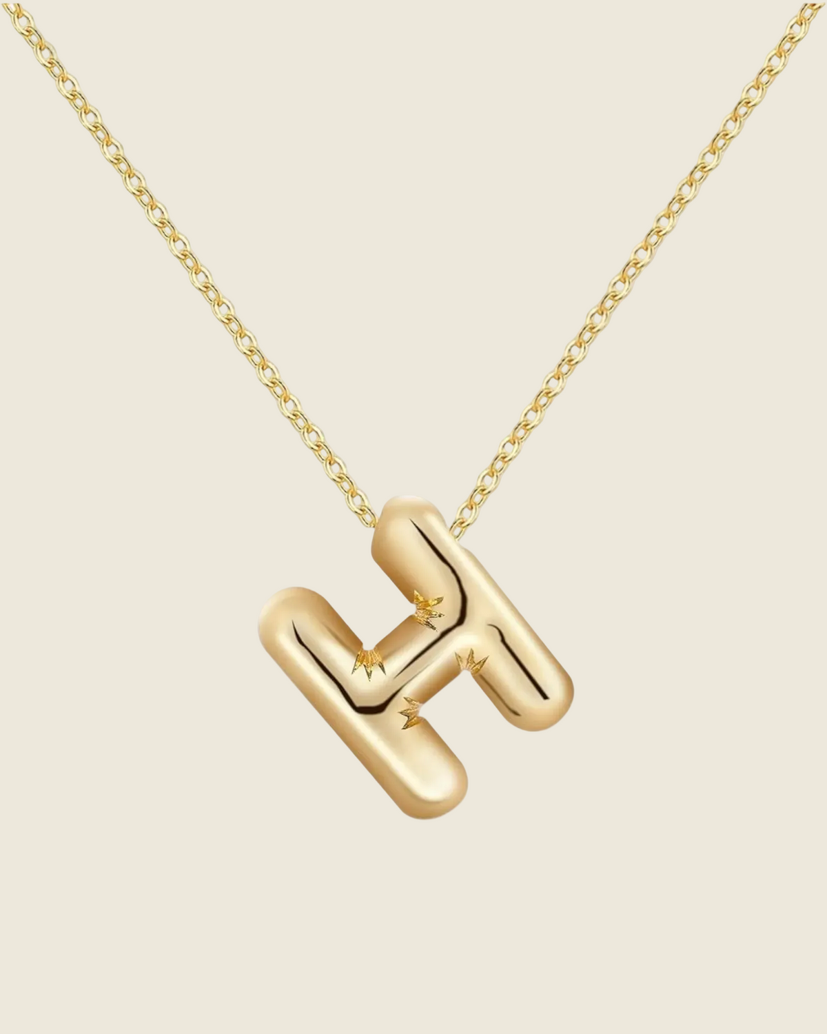 Collier doré à chaîne fine avec pendentif lettre H bombé