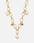 Collier doré • détails pierres blanches