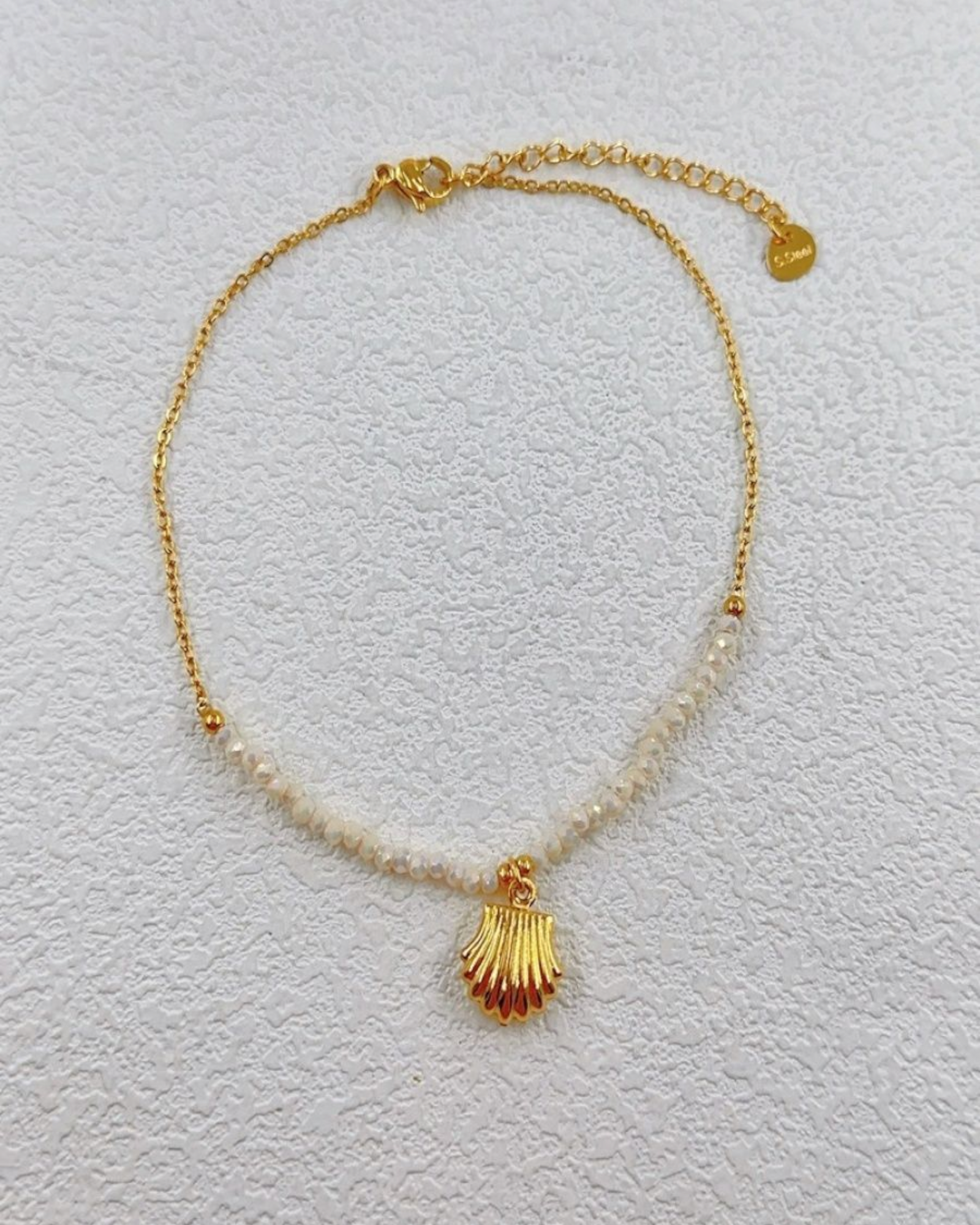 Chaîne de cheville en acier inoxydable doré avec perles et pendentifs coquillage